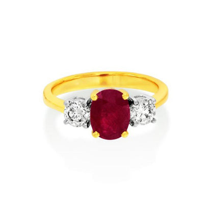 18Ct. Yellow Gold Ruby And Diamond Three Stone Ring with Oval Centre