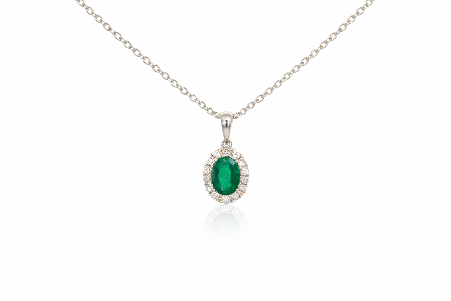 18ct White Gold Emerald &amp; Diamond Halo Pendant
