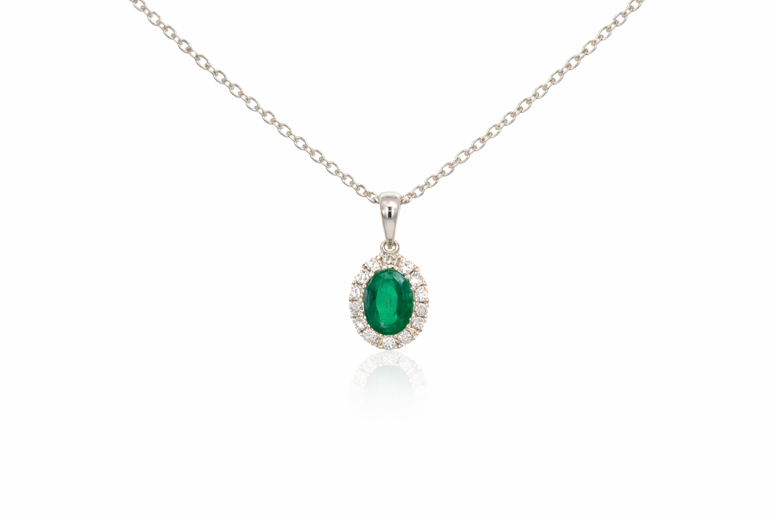 18ct White Gold Emerald &amp; Diamond Halo Pendant